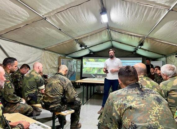 people in military uniform in a tent
