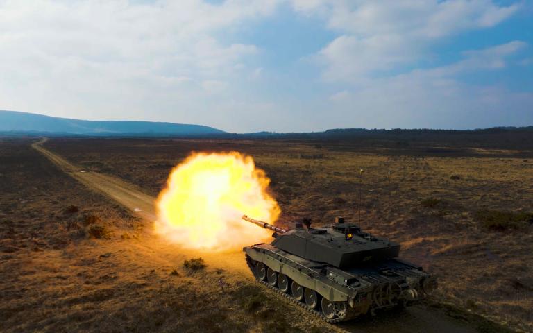 tank firing artillery
