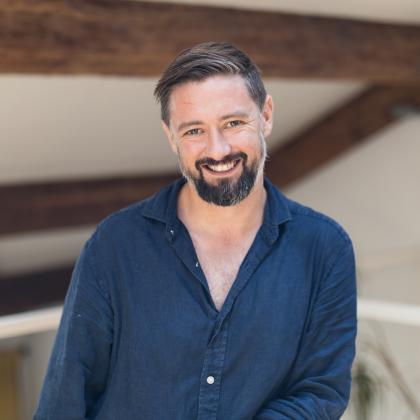 A headshot of Alex Griffiths