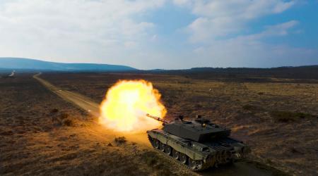 tank firing artillery