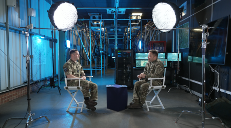 two people in uniform sitting opposite each other