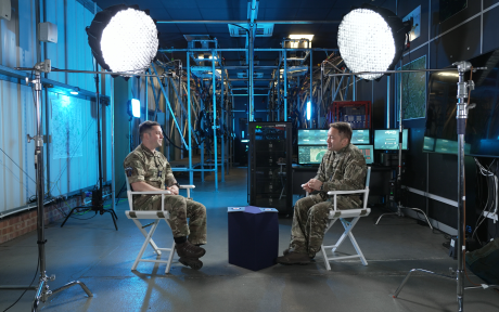 two people in uniform sitting opposite each other