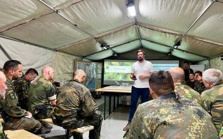 people in military uniform in a tent