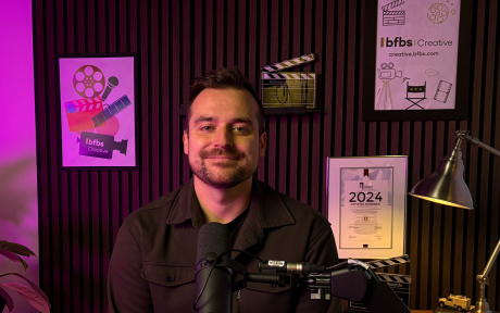 A picture of Tom O'Kelly, Senior Research and Insight Manager on the filming set for the Insight Shorts series on YouTube. There's a Watch Here button next to it. 