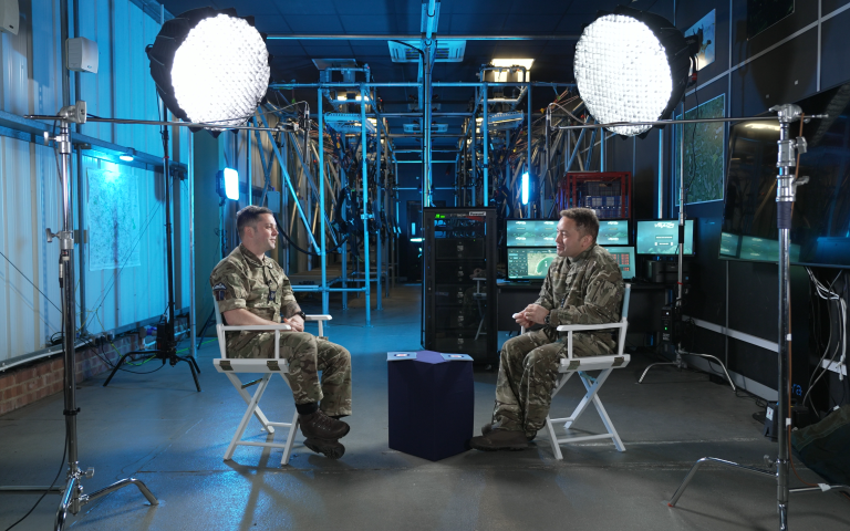 two people in uniform sitting opposite each other