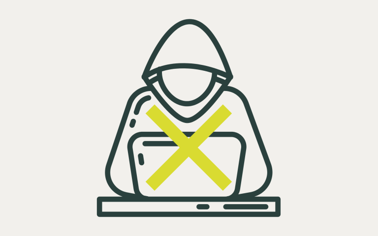 Hooded figure using a laptop with a cross over the screen